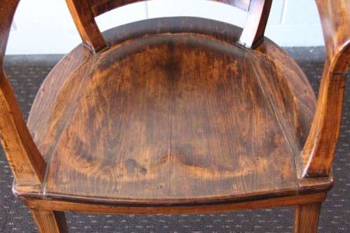 A gorgeous Edwardian antique oak fire house captain's chair with beautiful carved arm rests