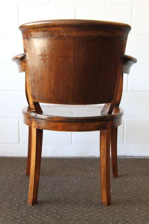 A gorgeous Edwardian antique oak fire house captain's chair with beautiful carved arm rests