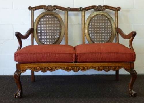 A beautiful solid Stink Wood Ball & Claw parlour couch with wicker backrest in great condition!!!
