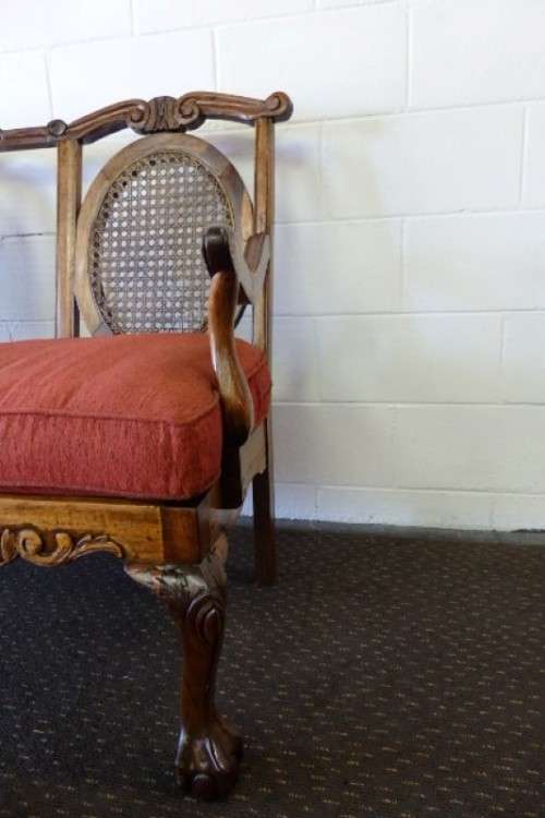 A beautiful solid Stink Wood Ball & Claw parlour couch with wicker backrest in great condition!!!