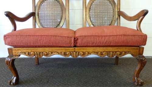 A beautiful solid Stink Wood Ball & Claw parlour couch with wicker backrest in great condition!!!