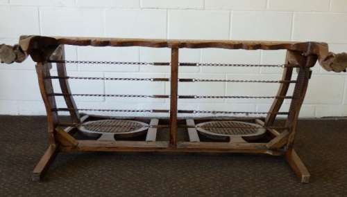 A beautiful solid Stink Wood Ball & Claw parlour couch with wicker backrest in great condition!!!