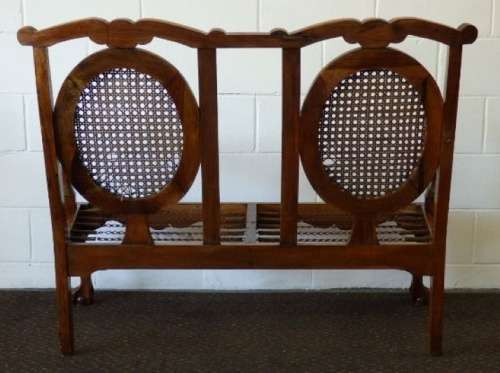 A beautiful solid Stink Wood Ball & Claw parlour couch with wicker backrest in great condition!!!
