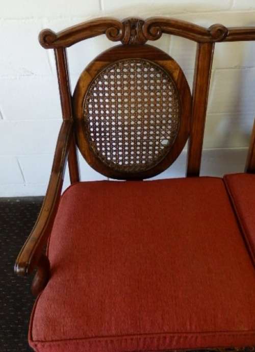 A beautiful solid Stink Wood Ball & Claw parlour couch with wicker backrest in great condition!!!