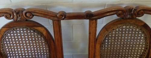 A beautiful solid Stink Wood Ball & Claw parlour couch with wicker backrest in great condition!!!