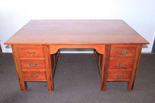 A magnificent large solid oak partners desk with loads of drawer space and ornate handles