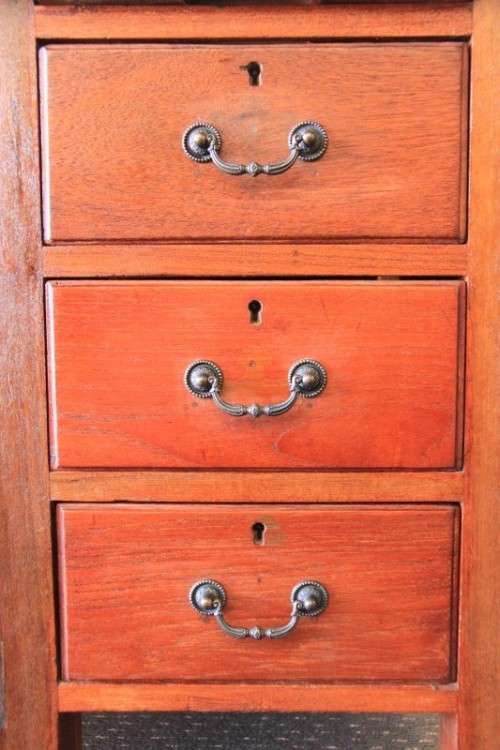 A magnificent large solid oak partners desk with loads of drawer space and ornate handles