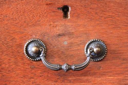 A magnificent large solid oak partners desk with loads of drawer space and ornate handles