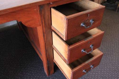A magnificent large solid oak partners desk with loads of drawer space and ornate handles