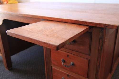 A magnificent large solid oak partners desk with loads of drawer space and ornate handles