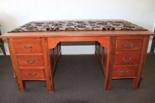 A magnificent large solid oak partners desk with loads of drawer space and ornate handles