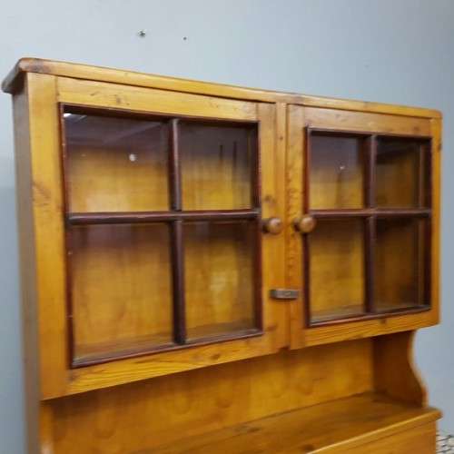 An exquisitely made antique solid Oregon wall mounting display cabinet with Imbuia detailing