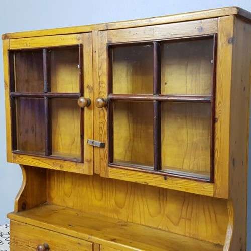 An exquisitely made antique solid Oregon wall mounting display cabinet with Imbuia detailing