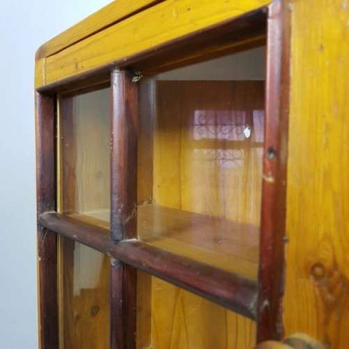 An exquisitely made antique solid Oregon wall mounting display cabinet with Imbuia detailing