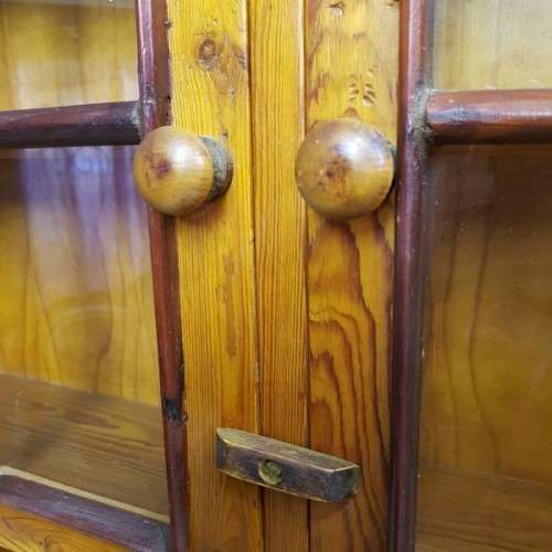 An exquisitely made antique solid Oregon wall mounting display cabinet with Imbuia detailing