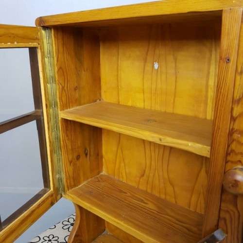 An exquisitely made antique solid Oregon wall mounting display cabinet with Imbuia detailing