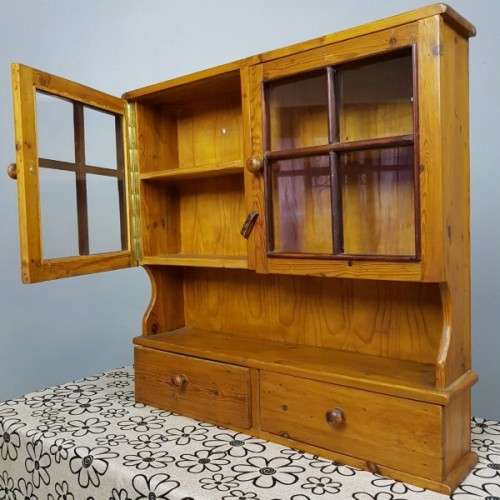 An exquisitely made antique solid Oregon wall mounting display cabinet with Imbuia detailing