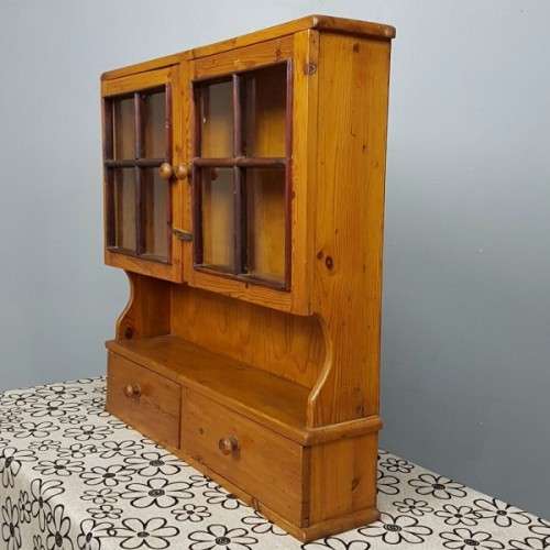 An exquisitely made antique solid Oregon wall mounting display cabinet with Imbuia detailing