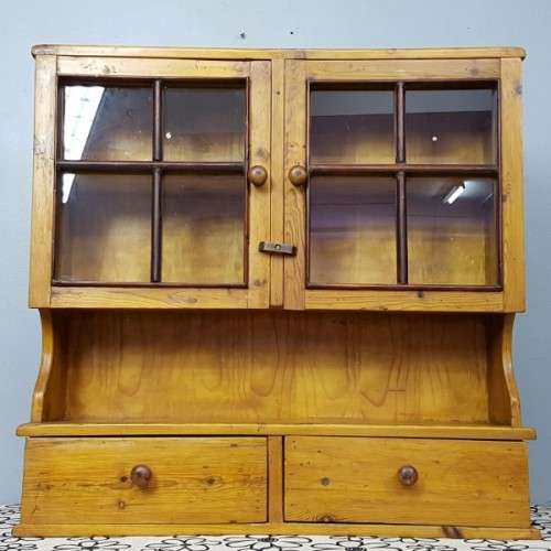 An exquisitely made antique solid Oregon wall mounting display cabinet with Imbuia detailing