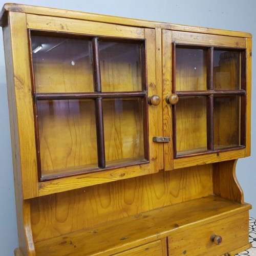 An exquisitely made antique solid Oregon wall mounting display cabinet with Imbuia detailing