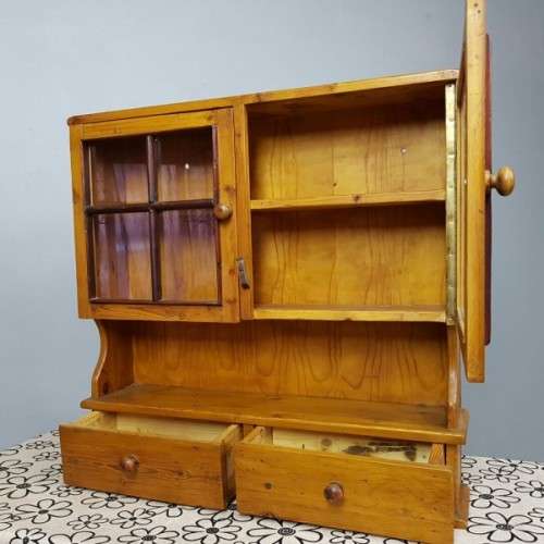 An exquisitely made antique solid Oregon wall mounting display cabinet with Imbuia detailing