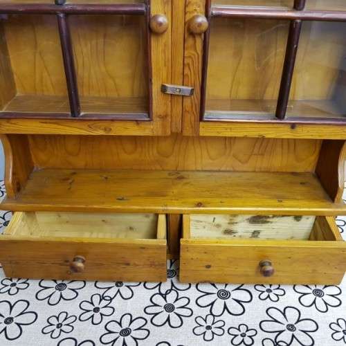 An exquisitely made antique solid Oregon wall mounting display cabinet with Imbuia detailing