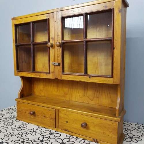 An exquisitely made antique solid Oregon wall mounting display cabinet with Imbuia detailing