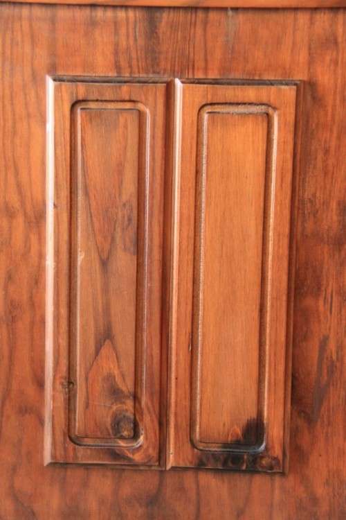 A stunning teak buffet server w/ two display shelves and ample storage space in remarkable condition