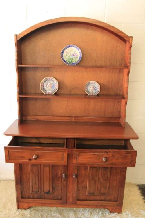 A stunning teak buffet server w/ two display shelves and ample storage space in remarkable condition