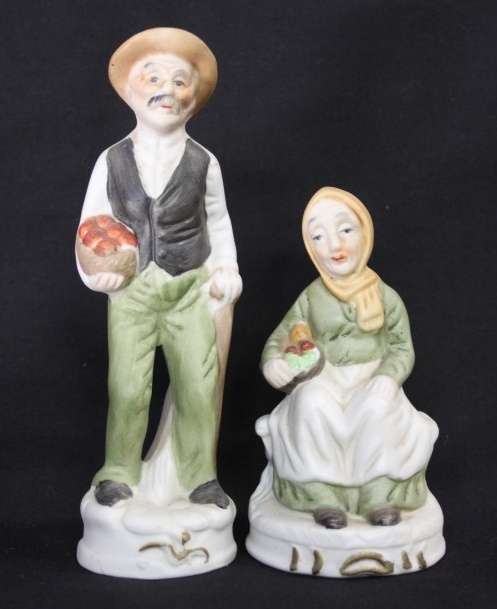 Two wonderful ceramic figurines of an a farmer and his wife with hand painted detailing bid/figurine