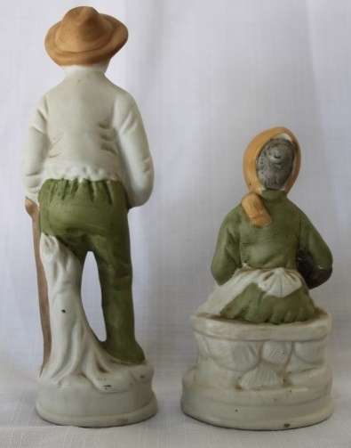 Two wonderful ceramic figurines of an a farmer and his wife with hand painted detailing bid/figurine