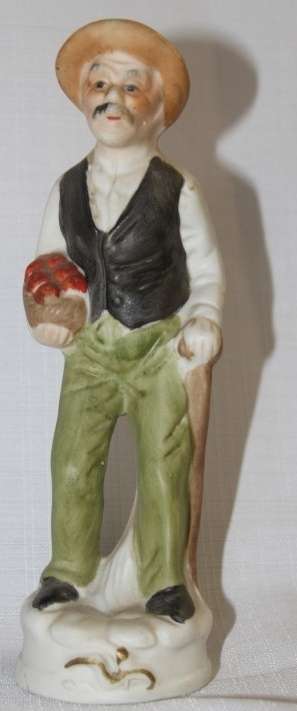 Two wonderful ceramic figurines of an a farmer and his wife with hand painted detailing bid/figurine
