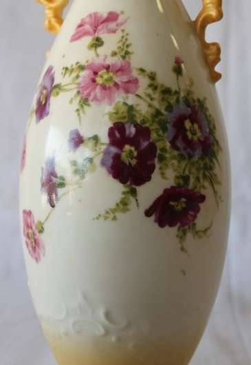 A gorgeous tall German-porcelain vase with scroll handles, flared rim and transfer print flowers