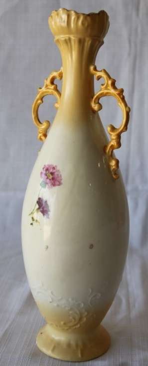 A gorgeous tall German-porcelain vase with scroll handles, flared rim and transfer print flowers