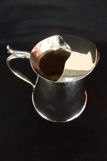 An awesome silver plated water jug/ pitcher with an ice lip in fabulous condition
