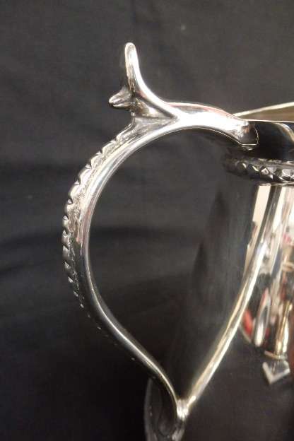 An awesome silver plated water jug/ pitcher with an ice lip in fabulous condition