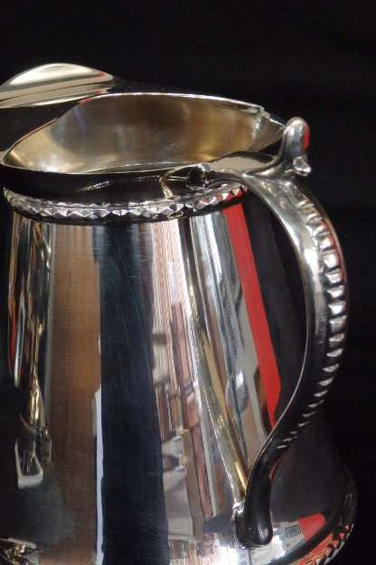 An awesome silver plated water jug/ pitcher with an ice lip in fabulous condition