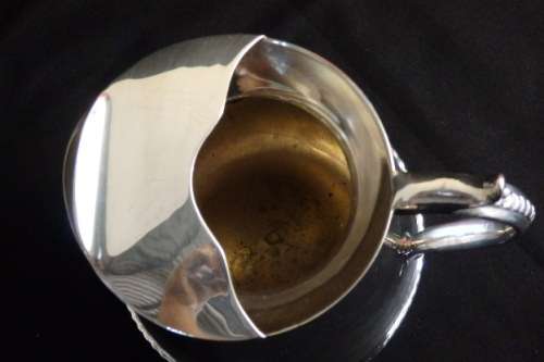 An awesome silver plated water jug/ pitcher with an ice lip in fabulous condition