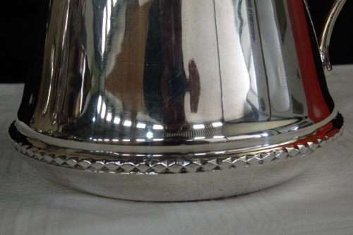 An awesome silver plated water jug/ pitcher with an ice lip in fabulous condition