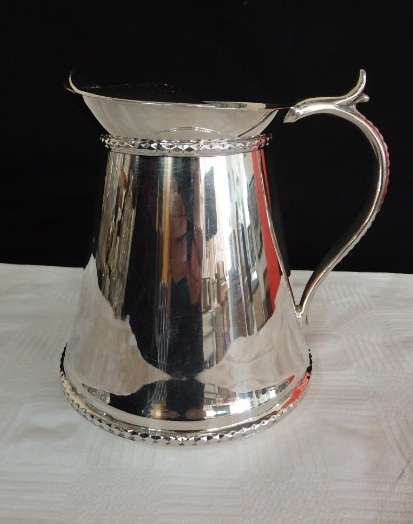 An awesome silver plated water jug/ pitcher with an ice lip in fabulous condition