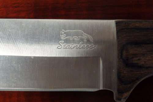 An amazing "full tang" hunting knife with knife sheath and belt slot in near mint condition