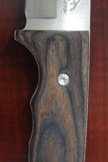 An amazing "full tang" hunting knife with knife sheath and belt slot in near mint condition