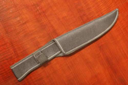 An amazing "full tang" hunting knife with knife sheath and belt slot in near mint condition