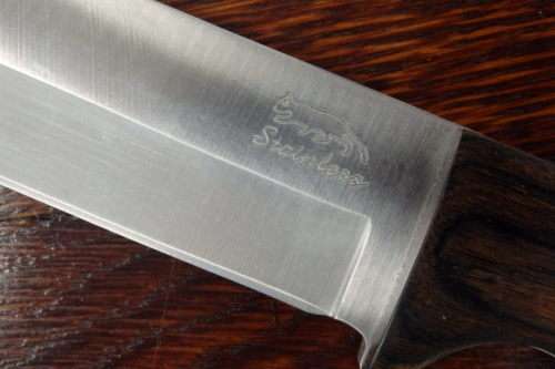 An amazing "full tang" hunting knife with knife sheath and belt slot in near mint condition