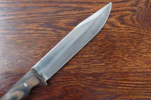An amazing "full tang" hunting knife with knife sheath and belt slot in near mint condition