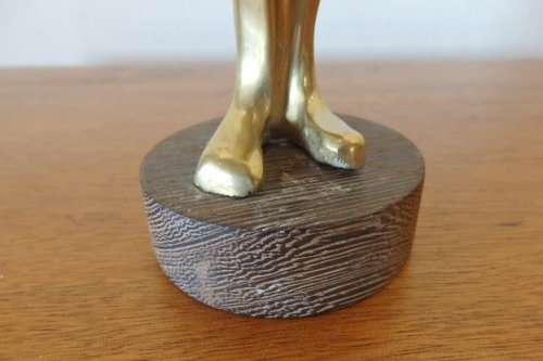 An incredible (tall) solid brass abstract figurine on a wooden stand in stunning condition