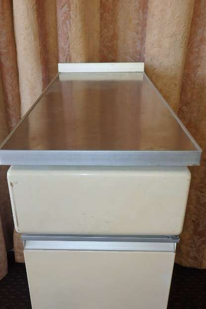 An awesome vintage "Retro" multi-purpose single door metal cabinet with a stainless steel top