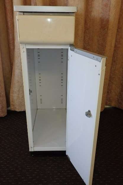 An awesome vintage "Retro" multi-purpose single door metal cabinet with a stainless steel top