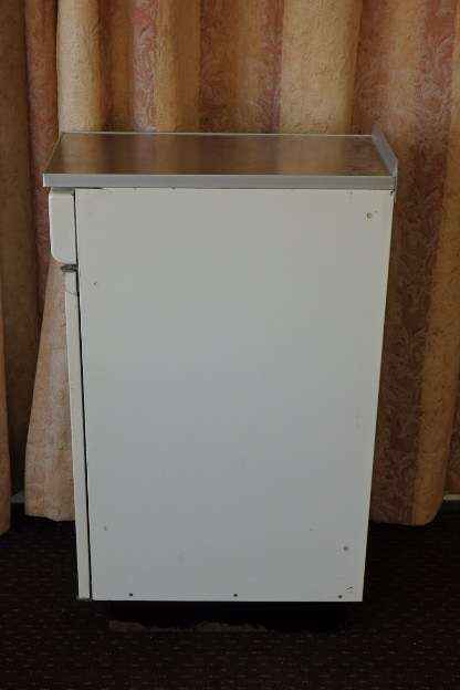 An awesome vintage "Retro" multi-purpose single door metal cabinet with a stainless steel top