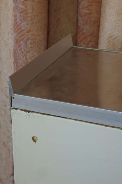 An awesome vintage "Retro" multi-purpose single door metal cabinet with a stainless steel top